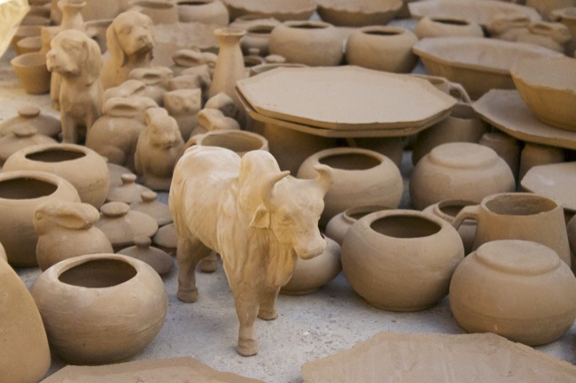 Some freshly fired clay pieces, including pots and a bull